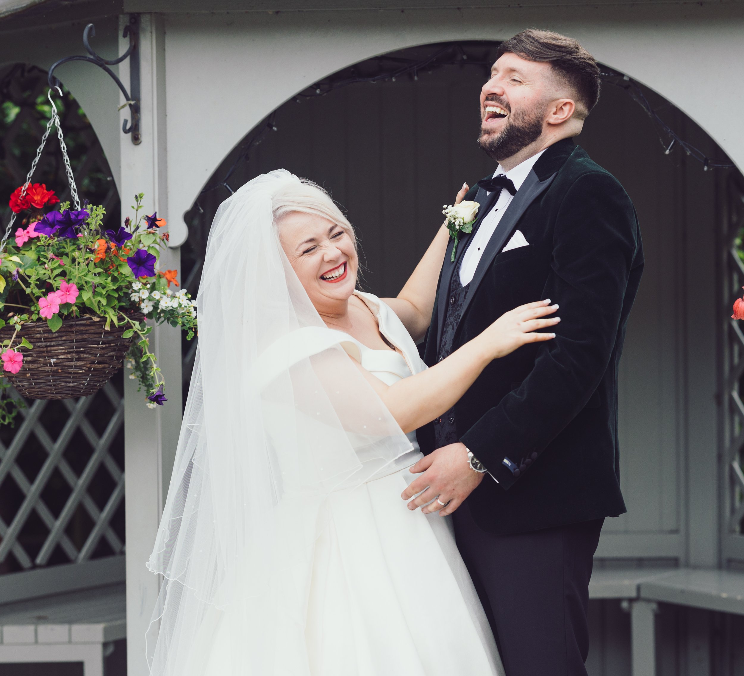 Bride and groom laughing during relaxed wedding portraits at Castletroy Park Hotel Limerick – JOD Photography