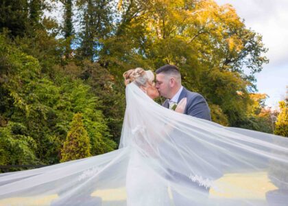 Newlyweds sharing a quiet moment under the twinkling lights at Vienna Woods Hotel, Cork – JOD Photography