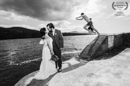 A passionate Kiss at kenmare bay while school children leap into the water-JOD'Photography