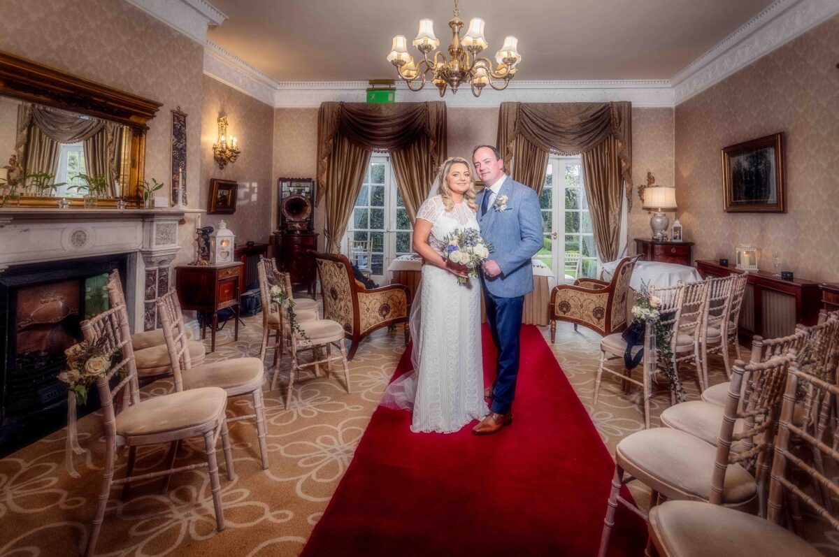 Bride and groom posing in the five star hotel in Cork City