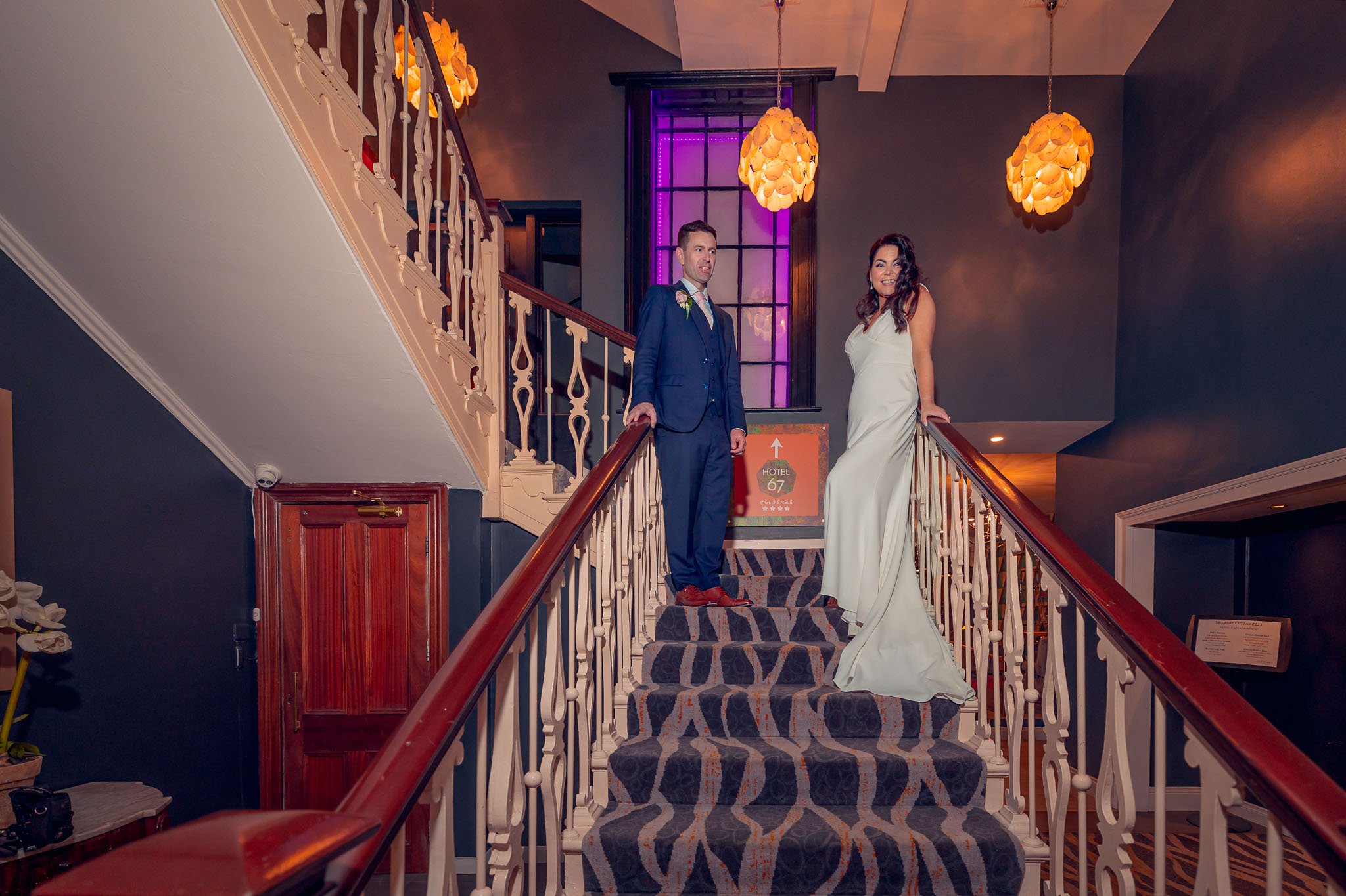 Bride and groom posing on the stairs at Killarney Heights Hotel Co Kerry