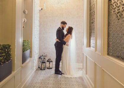Bride and groom share a moment between each other in the hallway of Killarney heights Hotel-JOD'Photography