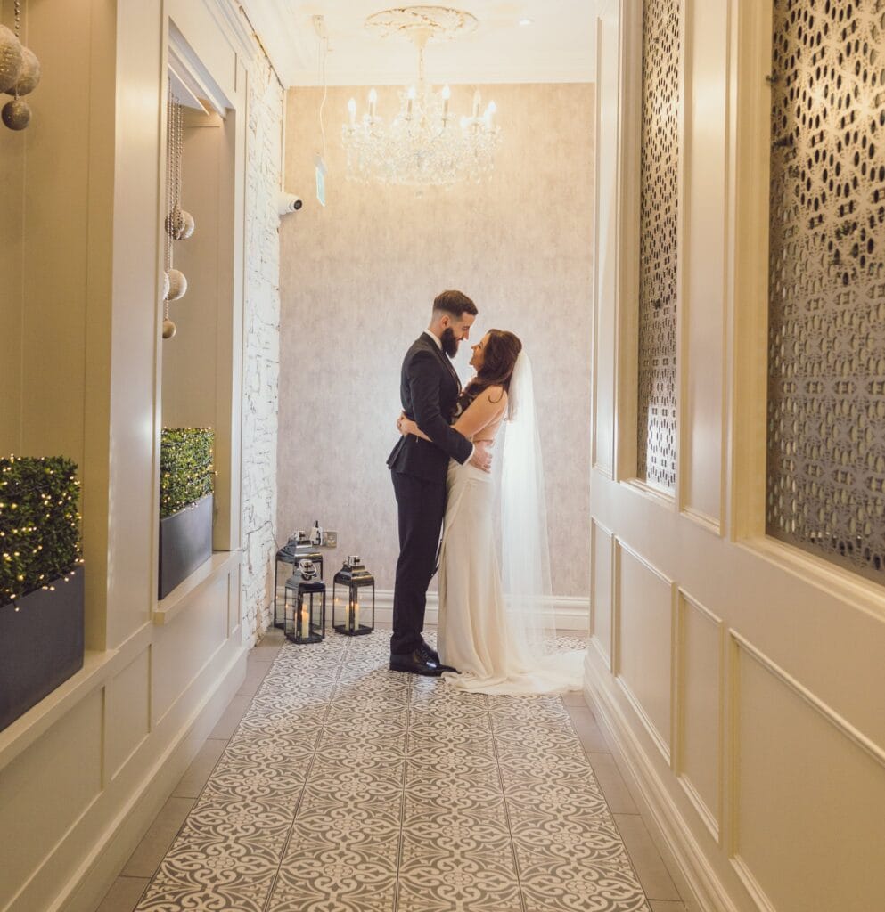 Bride and groom share a moment between each other in the hallway of Killarney heights Hotel-JOD'Photography
