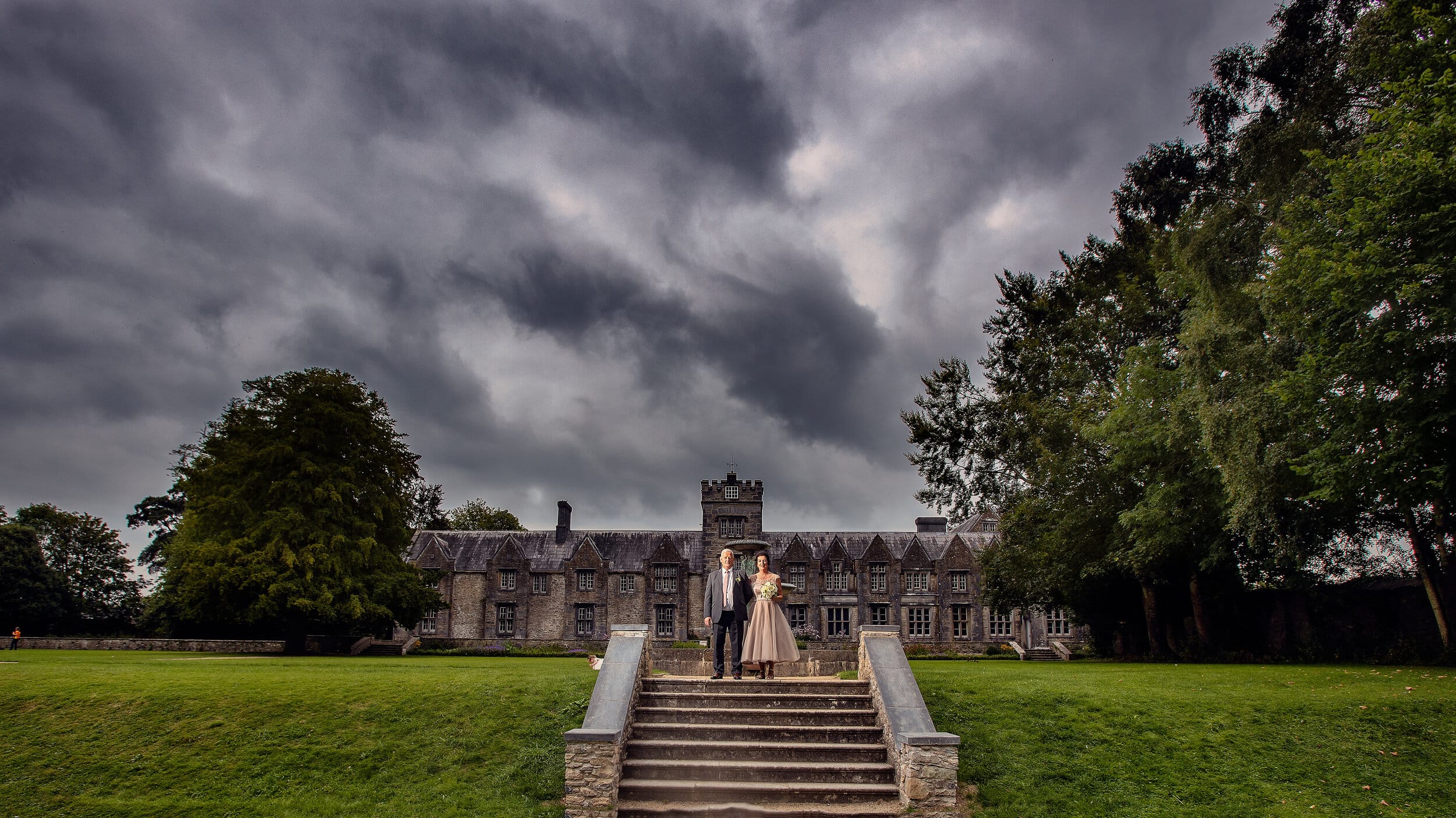 Bride and groom standing outside Mallow Castle Co Cork