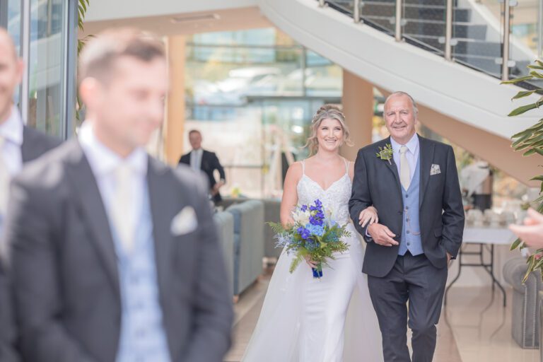 Bride and groomsmen striking a pose with the sun setting behind them in Cork, JOD'Photography