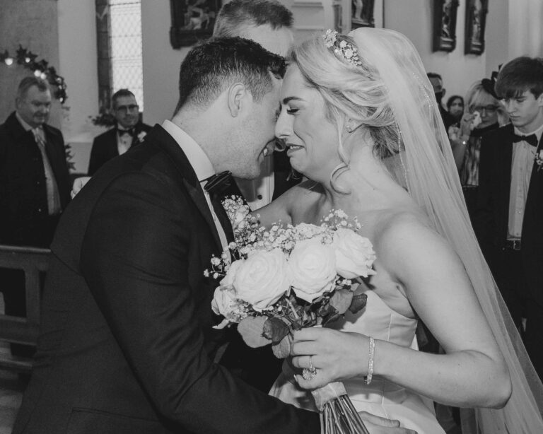 Bride cries as she embraces the groom at a church on Valentia island co kerry