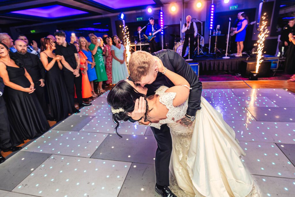 Dip kiss bride and groom