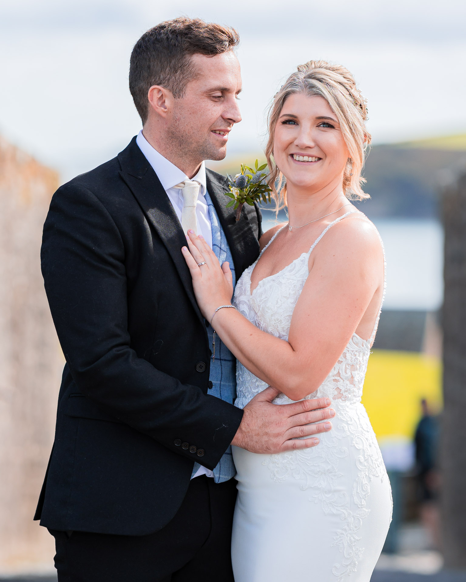 Groom admiring his bride while holding her hand in the rain at Killarney, JOD'Photography