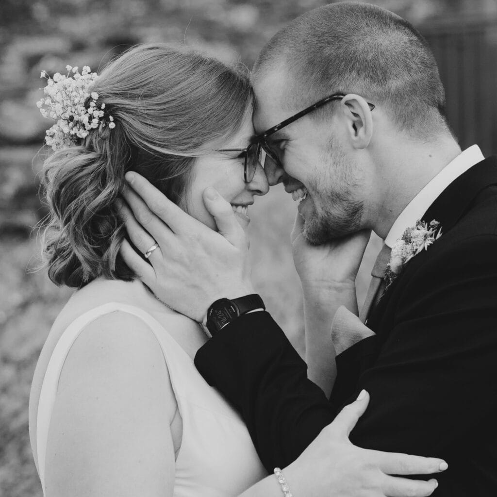 Groom holding his bride close under the colorful autumn leaves of Tralee, Kerry, JOD'Photography