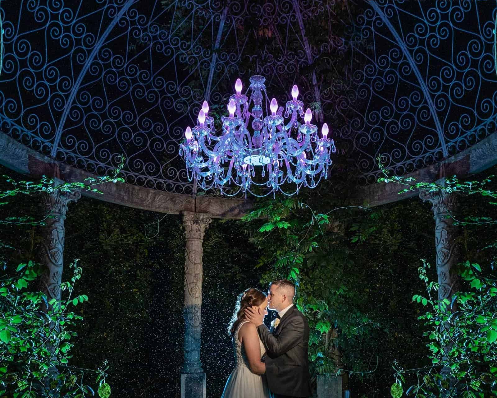 Groom kisses his wife on the forehead as they share a romantic moment in Ballyseedy Castle Kerry-JOD'Photography