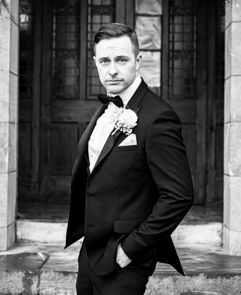 Groom posing like zoo-lander from the movie out side the church in Kerry