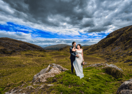 Groom romantically kissing his bride at Molls Gap Kenmare Co Kerry