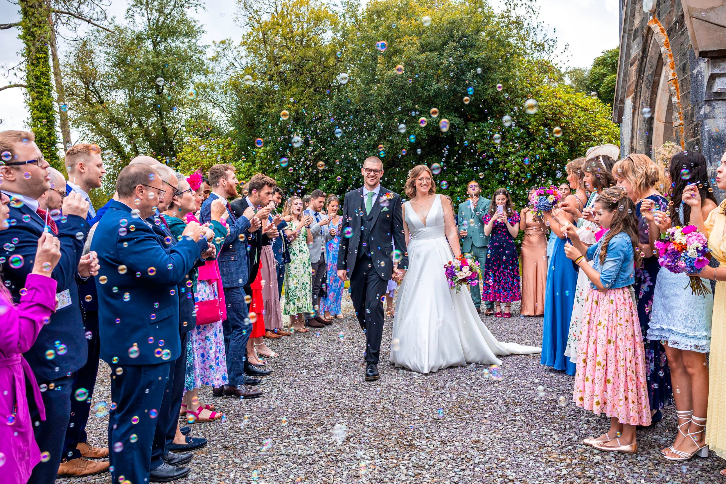Mother and father wait patiently as there daughter comes down the stairs in her wedding dress at their home in West Cork Ireland