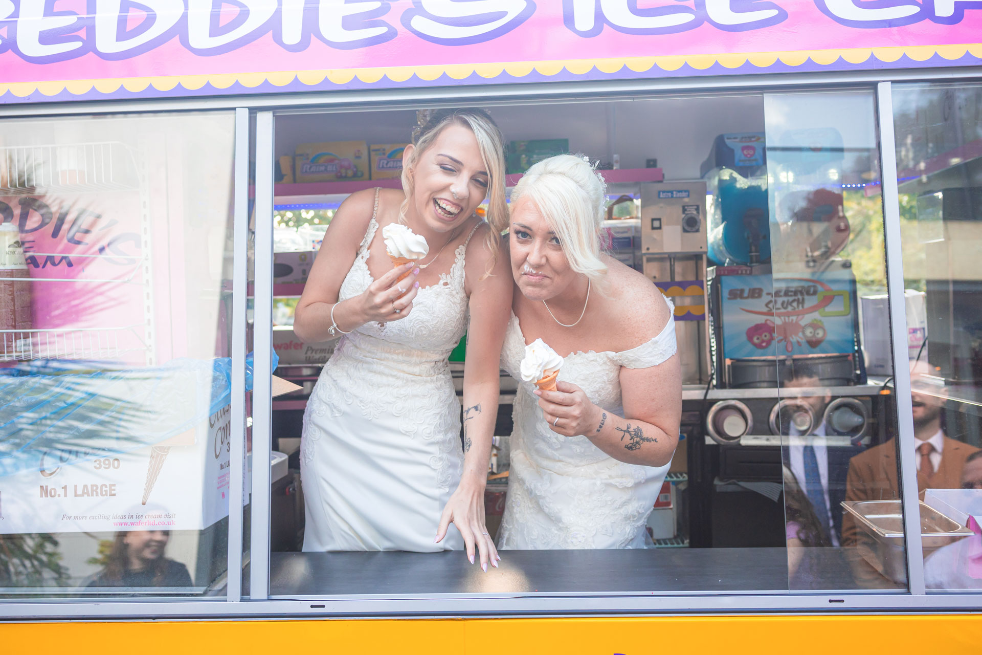 Bride and groom walking through a field in Cork with dramatic skies, JOD'Photography
