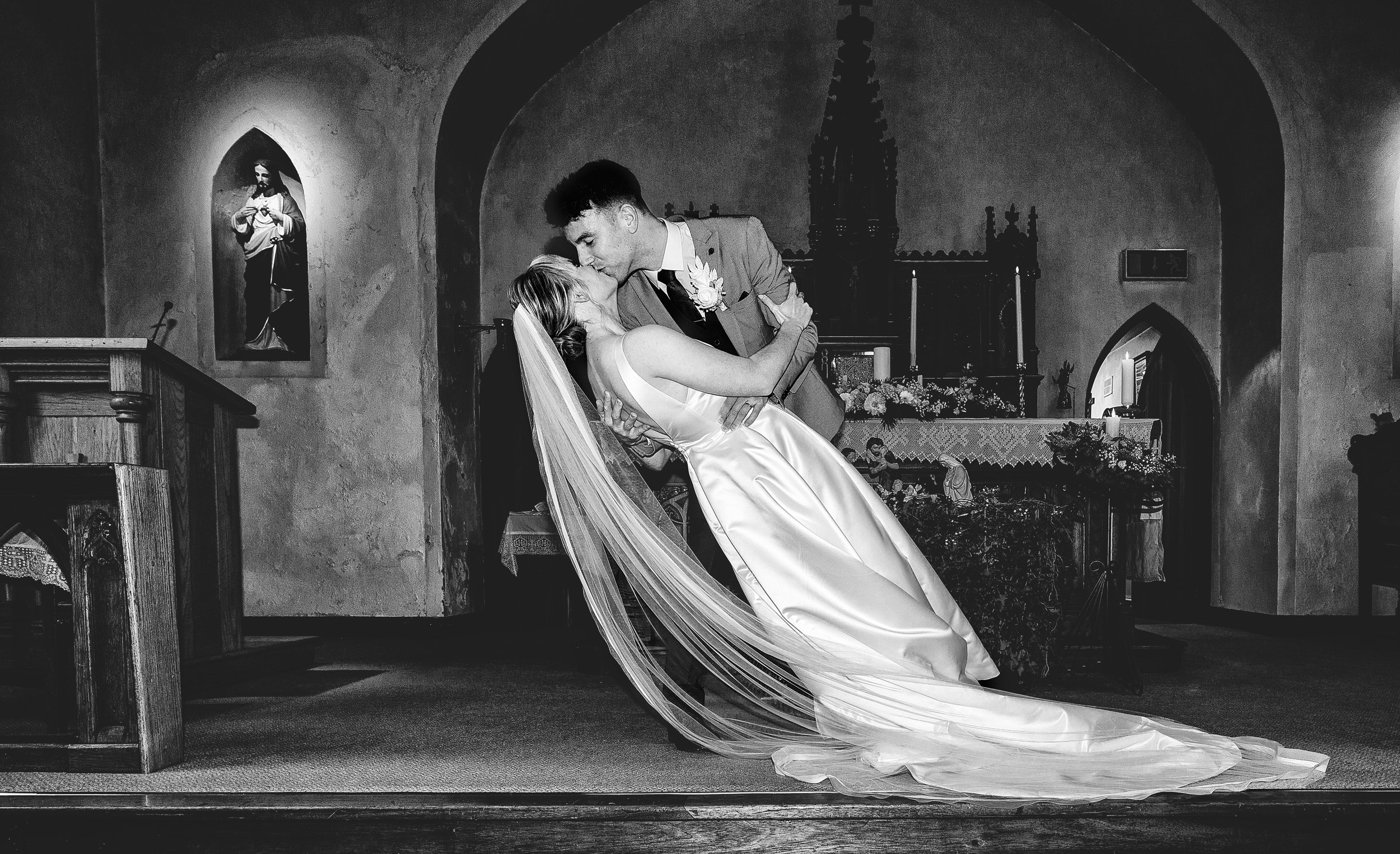 Newly weds sharing a first kiss in Kilmichael church Co Cork