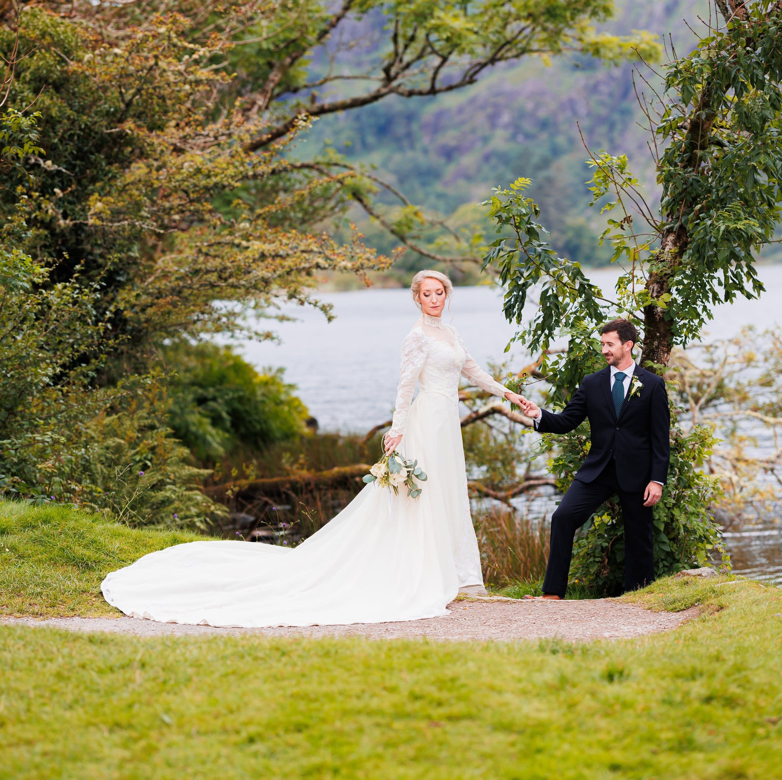 Bride walking through Fota Island Resort gardens on wedding day — JOD Photography