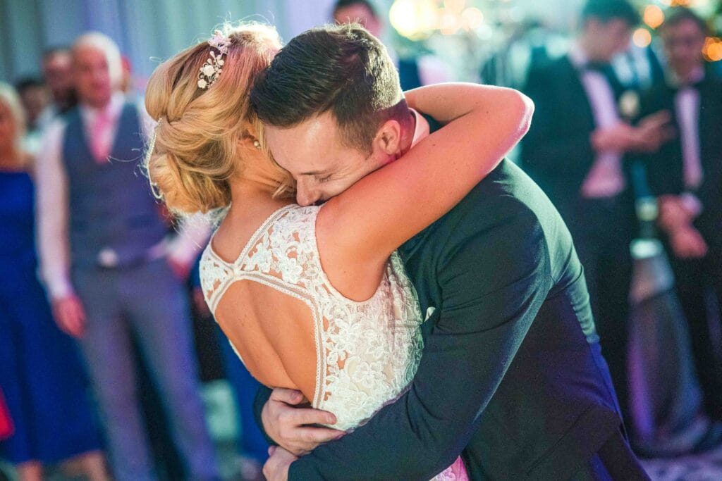 First dance groom gazes into the eyes of his wife as they dance to their first song at the Great Southern Hotel Killarney