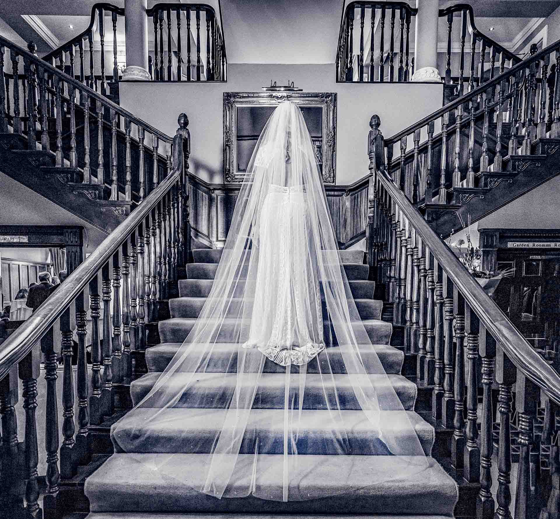 ride and groom walking through the rain in Killarney National Park, JOD'Photography