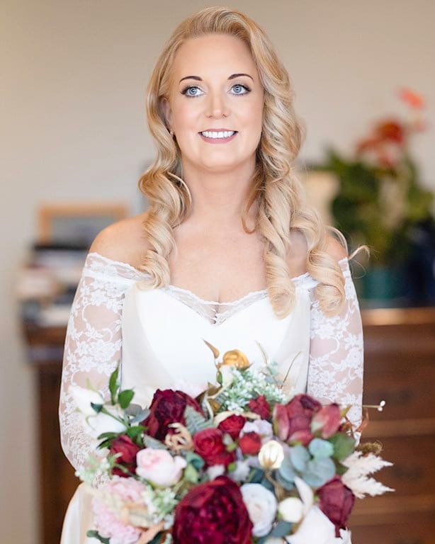 Stunning portrait of a bride as she is glowing in morning light in Kinsale Co Cork