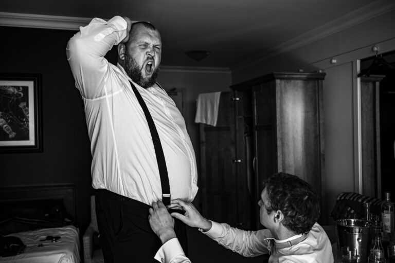 Groom laughing during the speeches at his Garryvoe Hotel wedding reception
