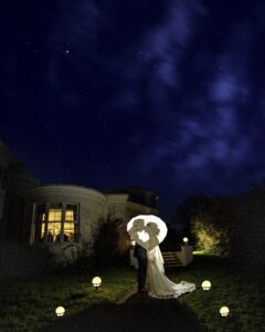 Bride smiling as she walks toward the ceremony entrance