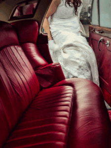 Bride arriving in a vintage car at a wedding venue in Limerick - JOD'Photography