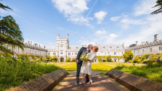 Romantic couple portrait with blooming flowers at UCC - JOD Photography