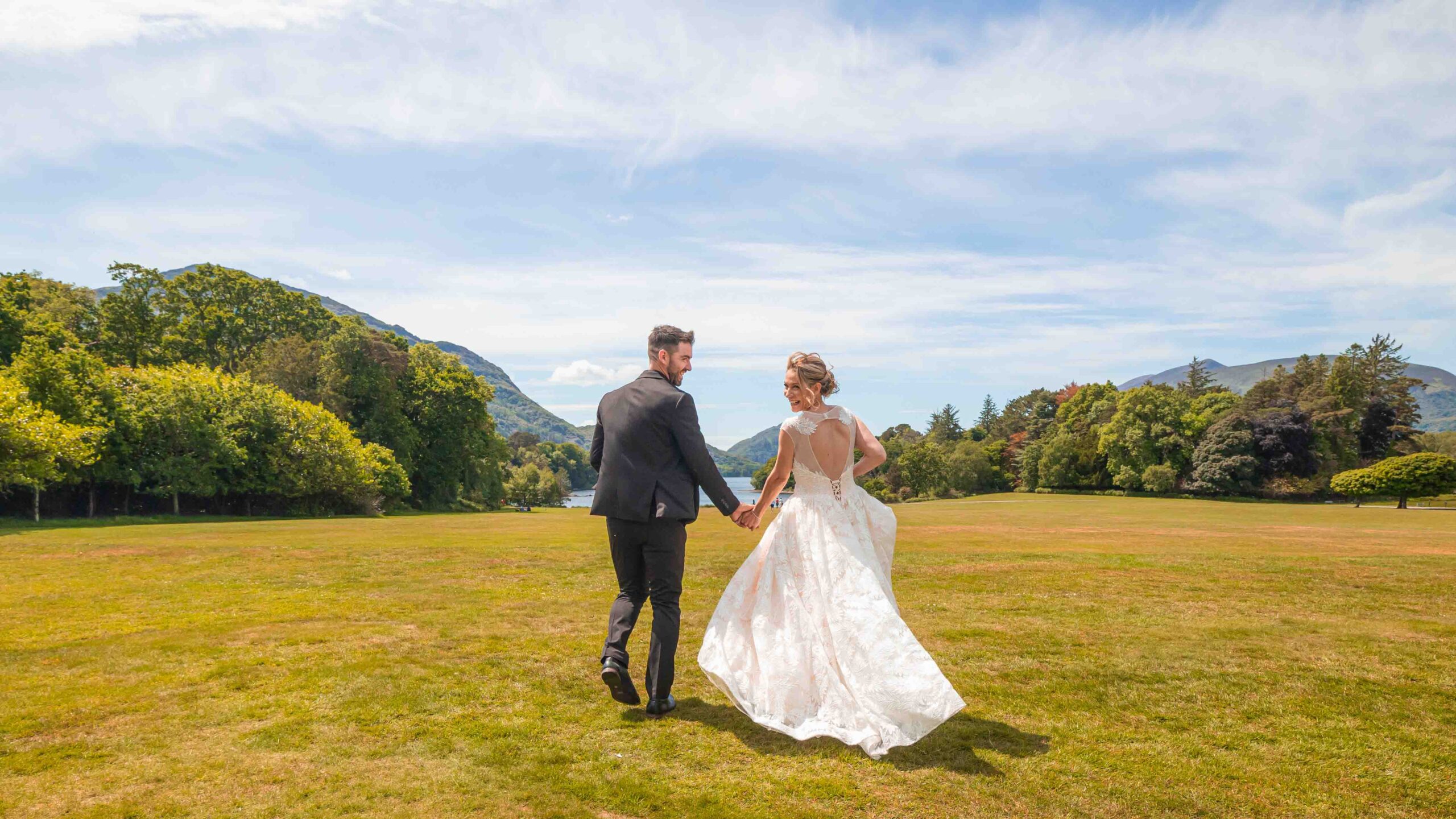 Holly looking back mid run through the field at Muckross House JODPhotography
