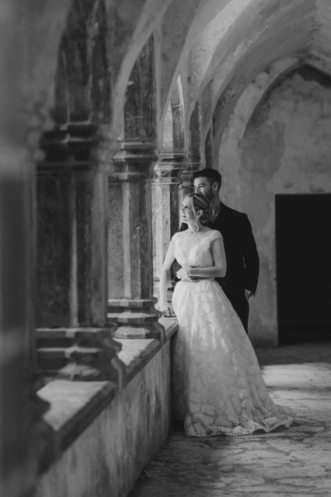 Wide shot of Muckross Abbey with wedding party – JOD'Photography