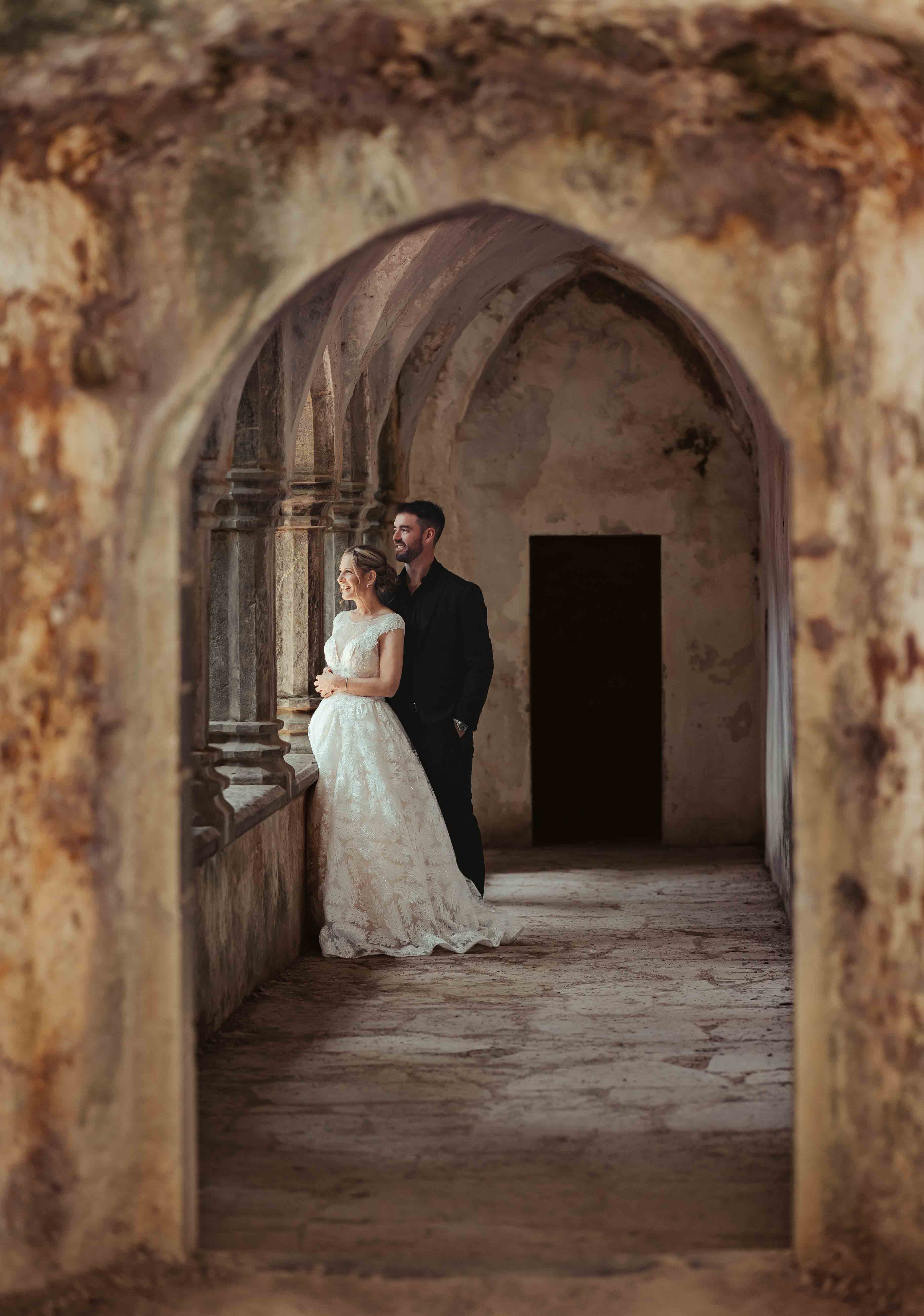 Wide shot of Muckross Abbey with wedding party – JOD'Photography