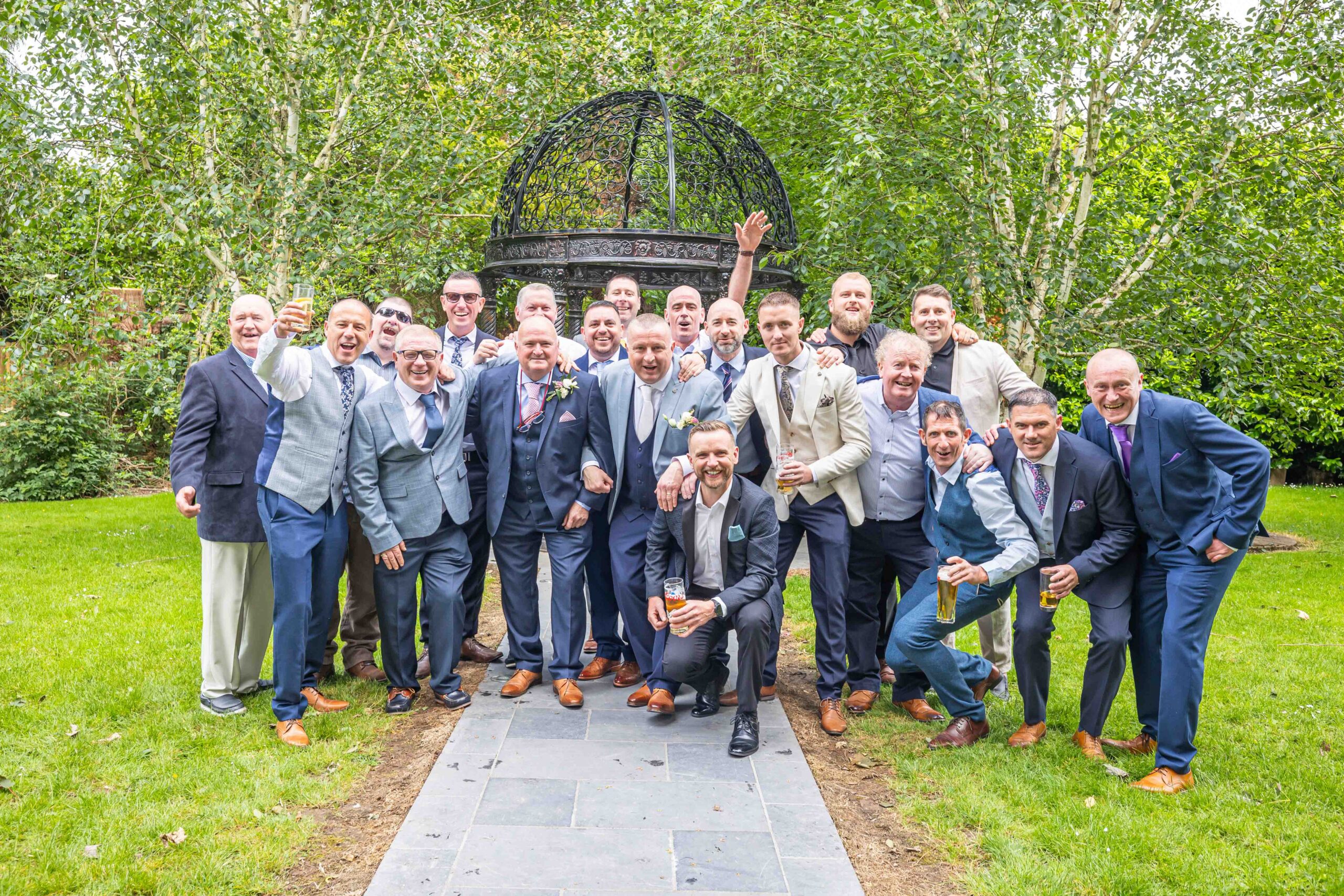 Groomsmen cheers at the bar JODPhotography