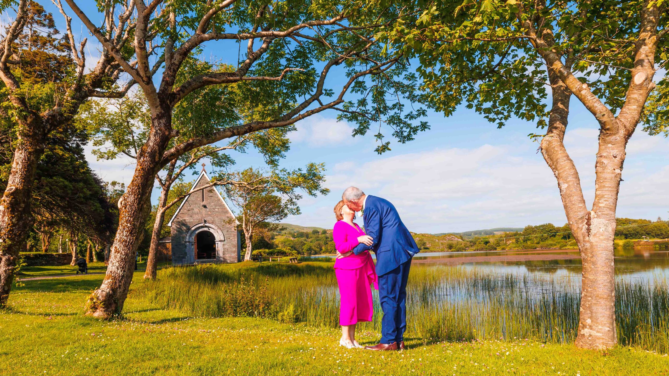 Groom arriving at Gougane Barra carrying a wooden box JODPhotography