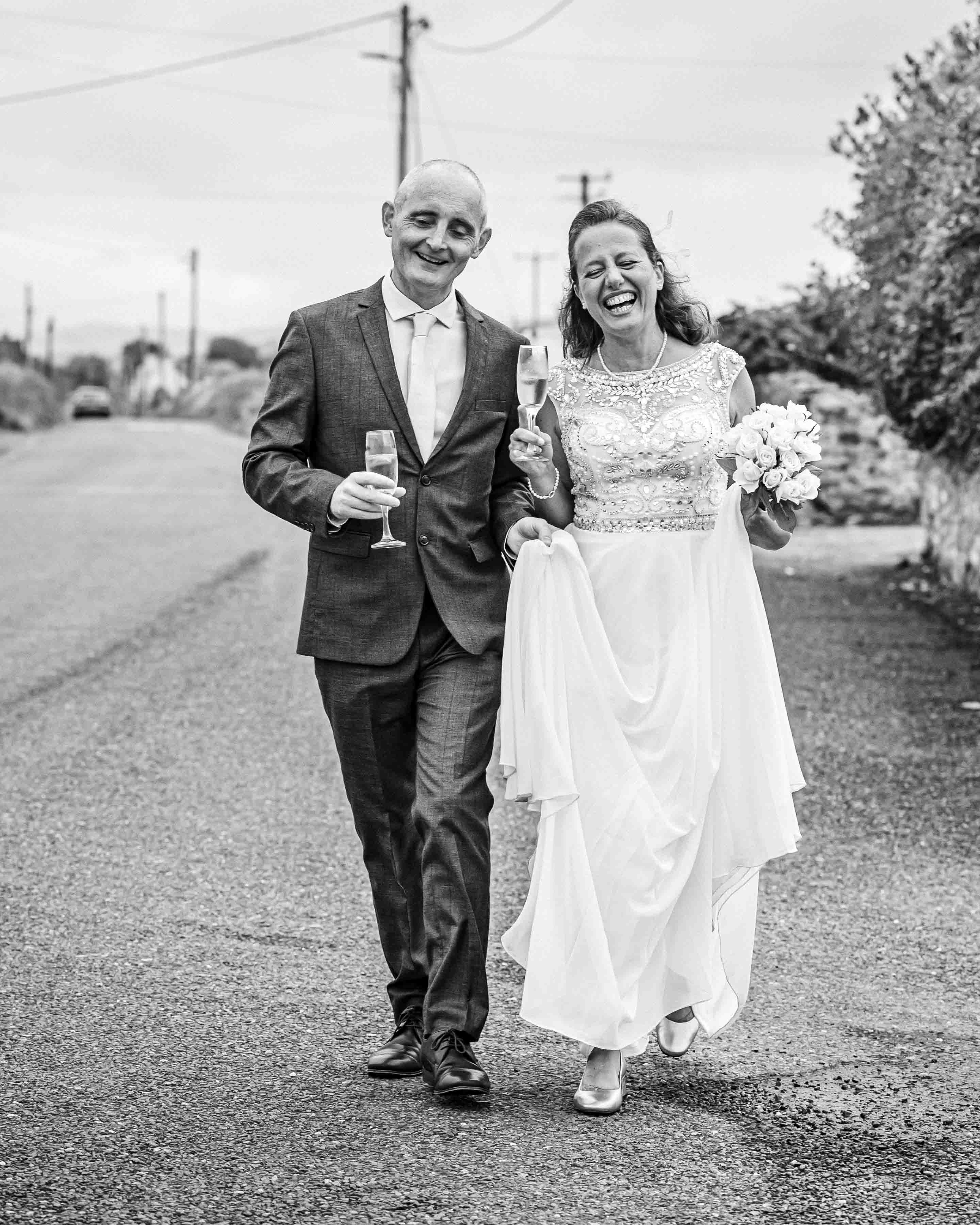 Bride and groom smiling during vows in Kerry – JOD Photography