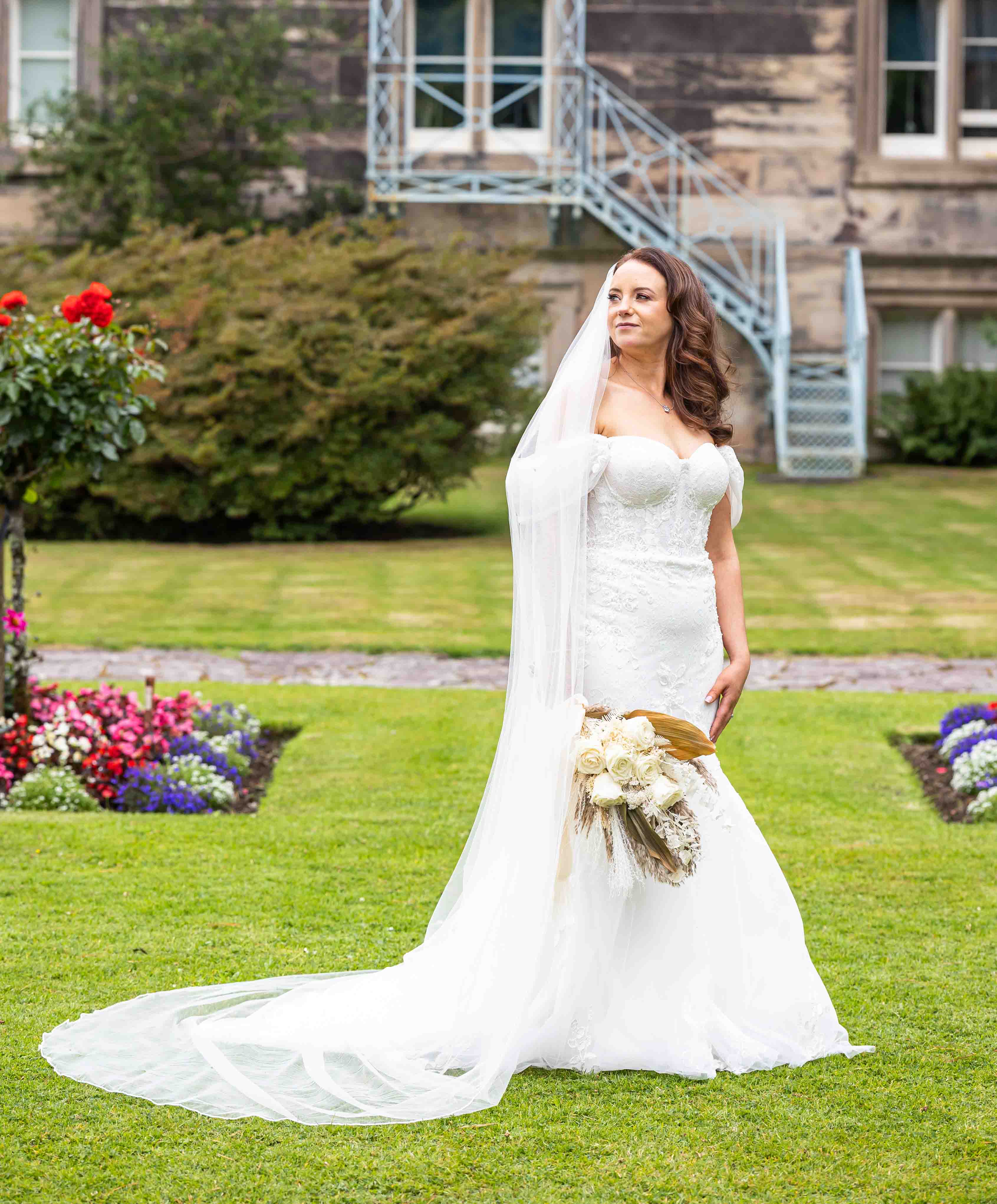 The newlyweds walking hand-in-hand through the gardens – JOD Photography