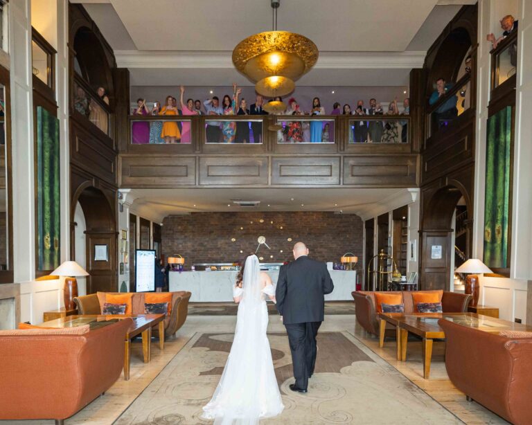Groom adjusting his tie in the suite at The Brehon Hotel – JOD Photography