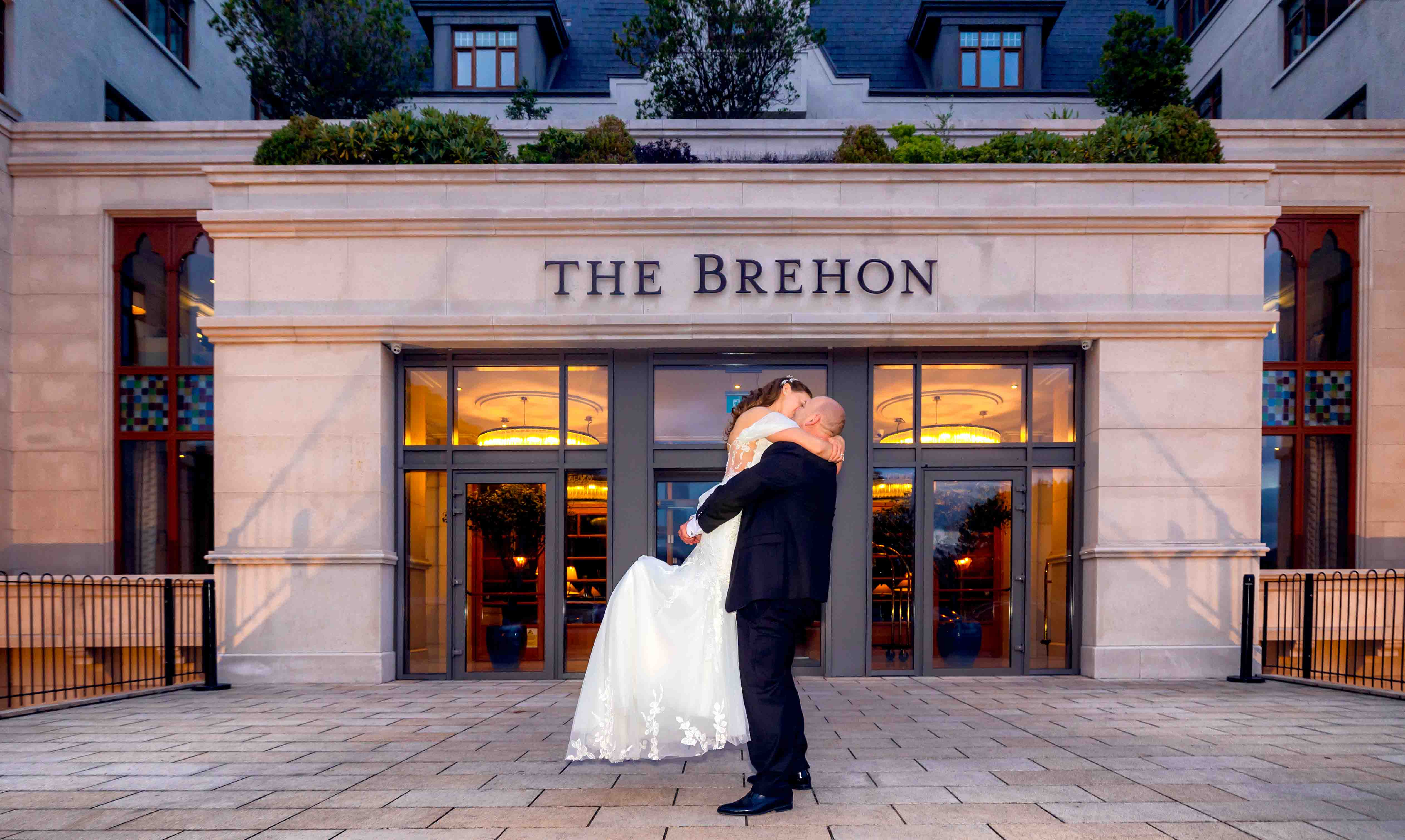 The Brehon Hotel illuminated at night during the wedding – JOD Photography