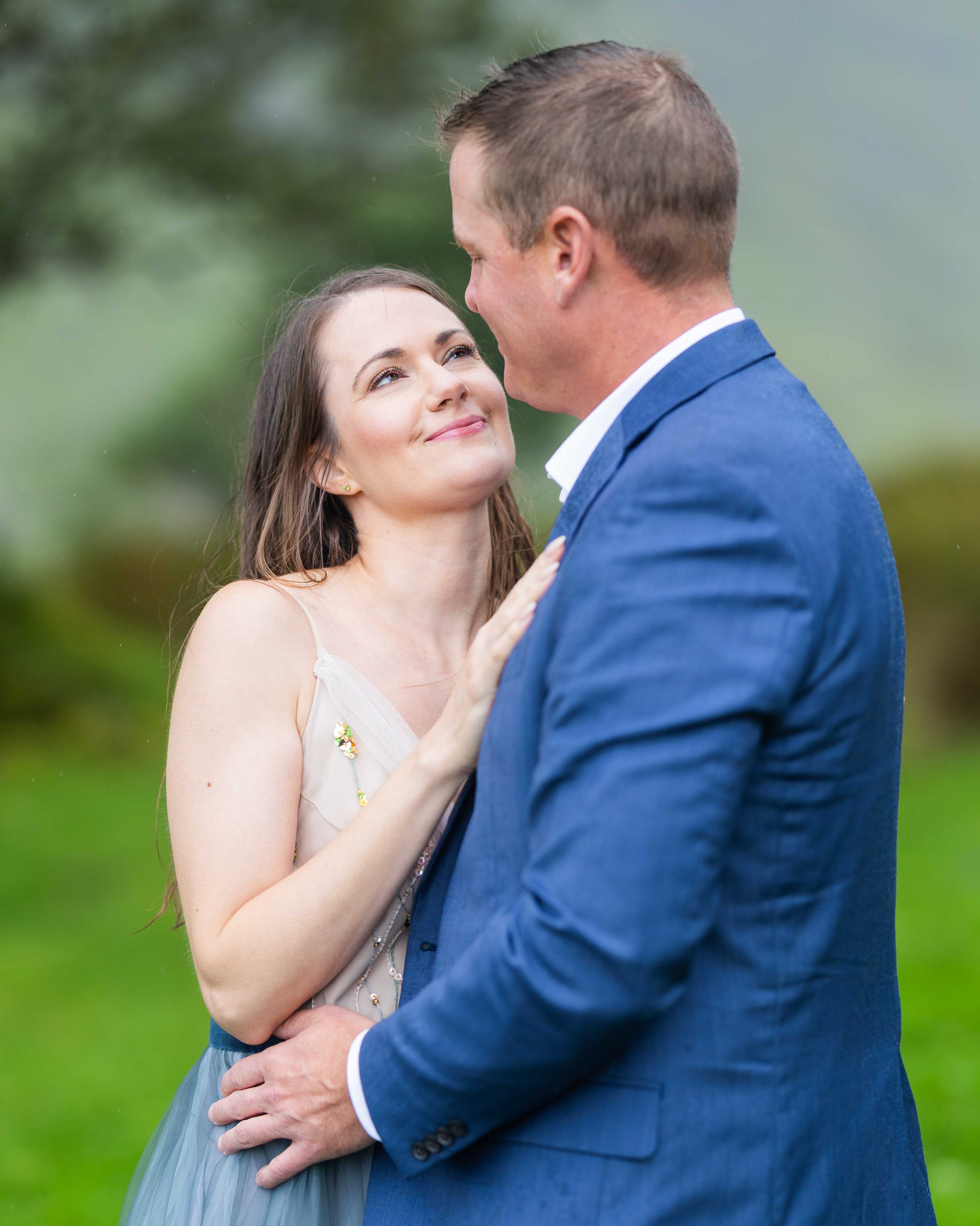 the rugged mountain road winding through the Gap of Dunloe with the couple in view - JOD'Photography