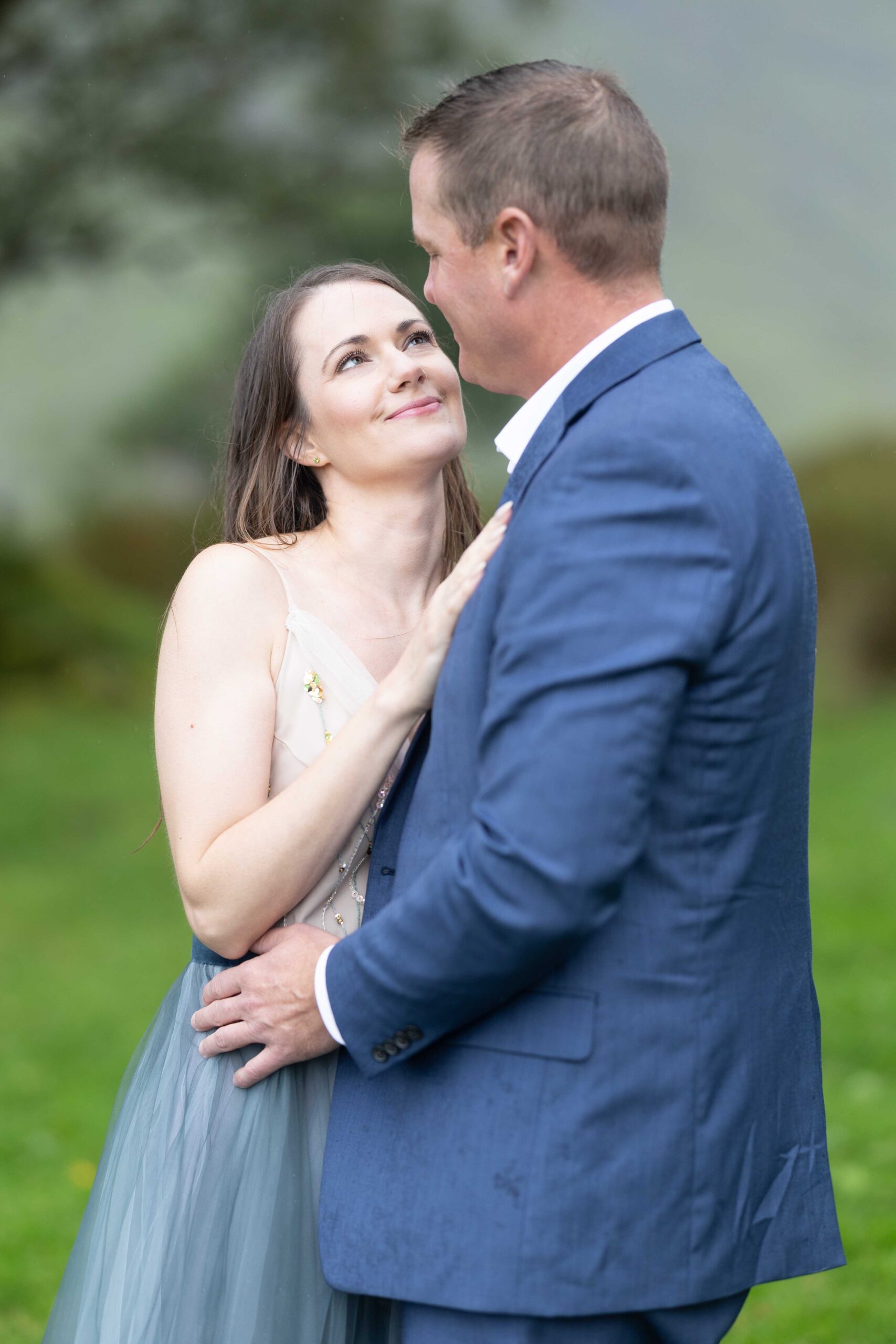 the rugged mountain road winding through the Gap of Dunloe with the couple in view - JOD'Photography