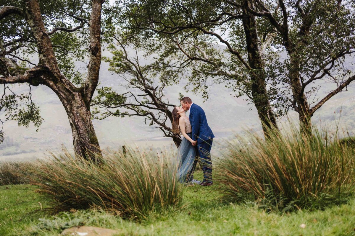 Bride and groom walking together in natural outdoor light