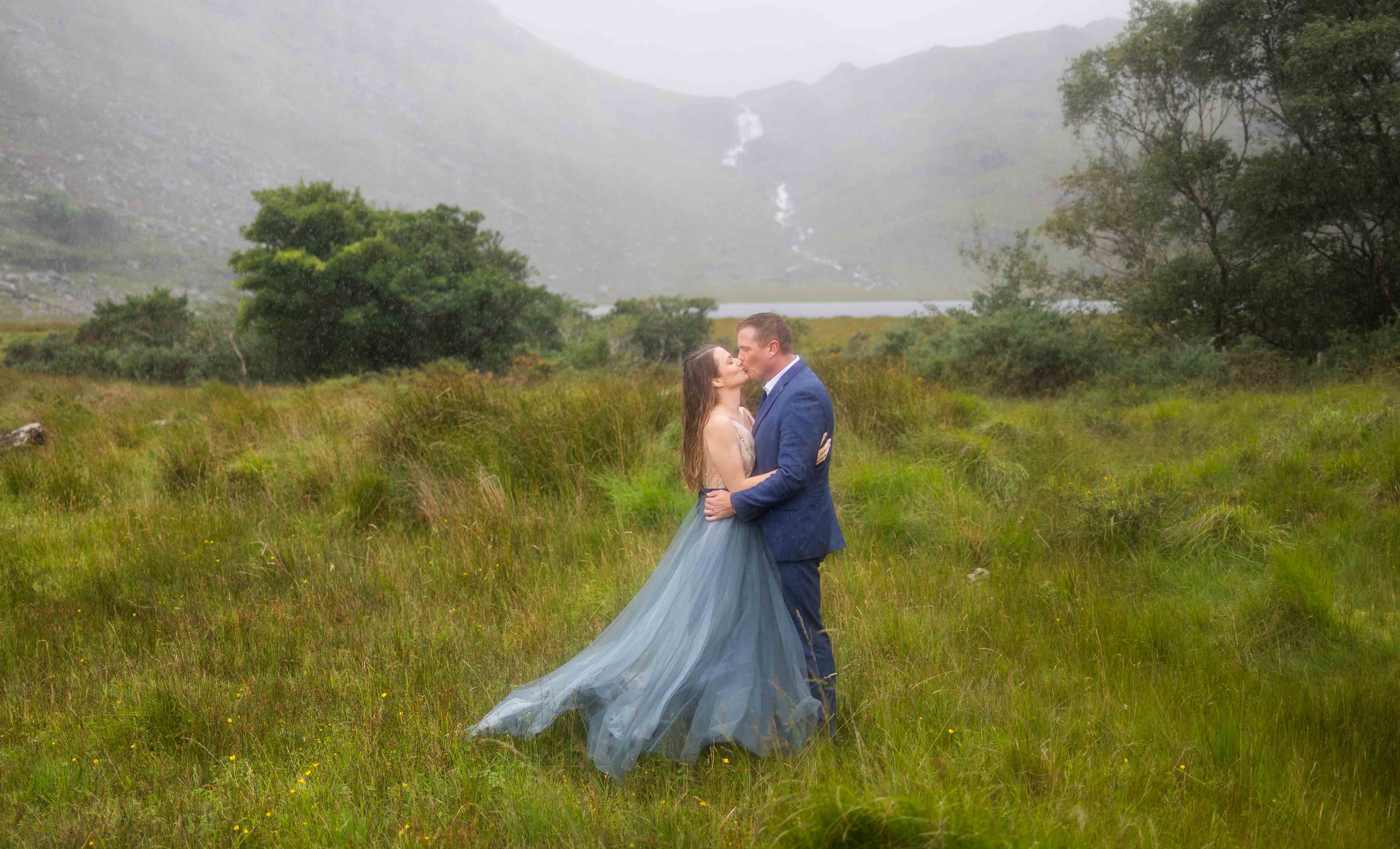 Matt and Heather walking past ancient stone walls in the heart of the Black Valley - JOD'Photography