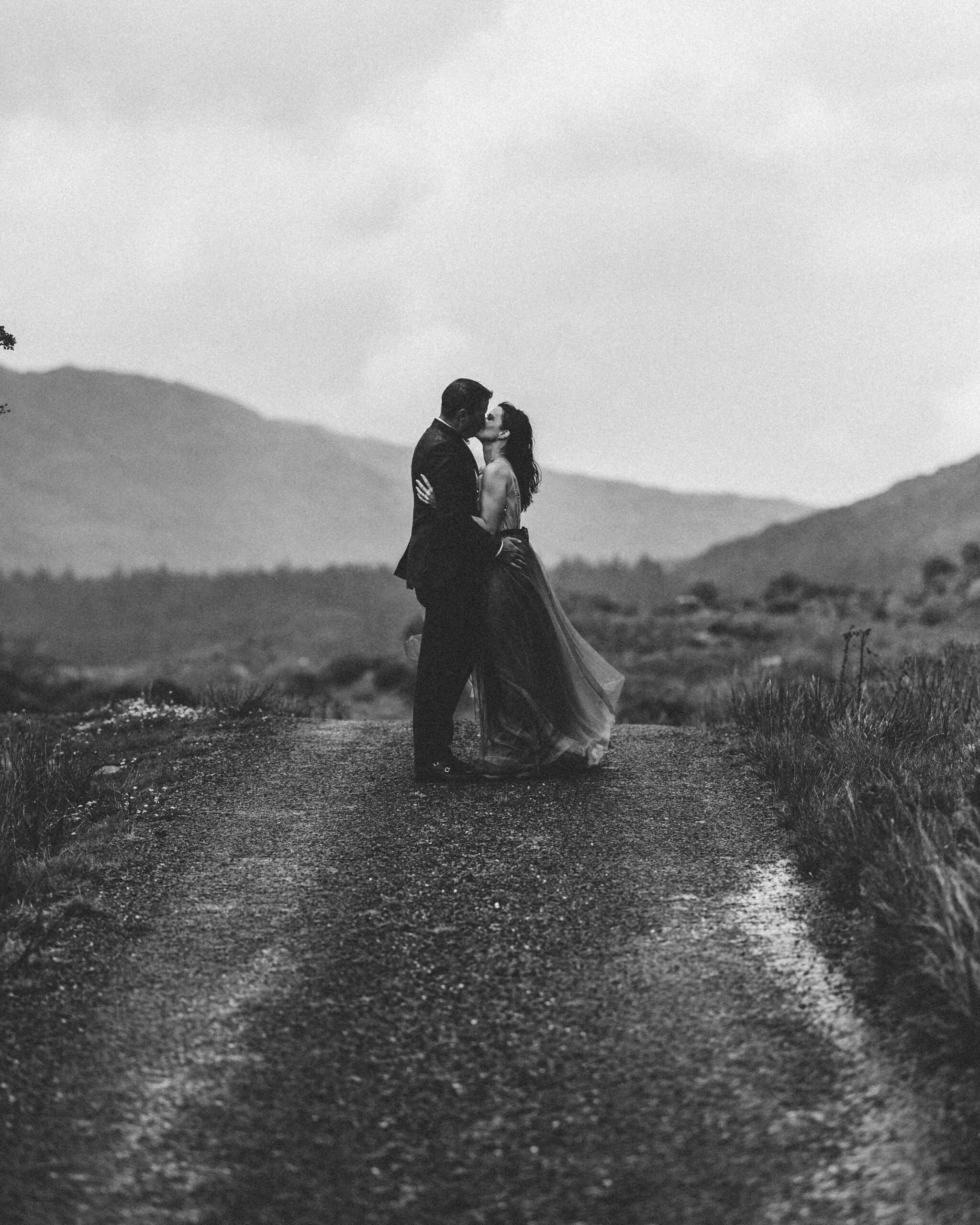 dramatic landscape shot of the Gap of Dunloe peaks and lakes with Matt and Heather framed JODPhotography