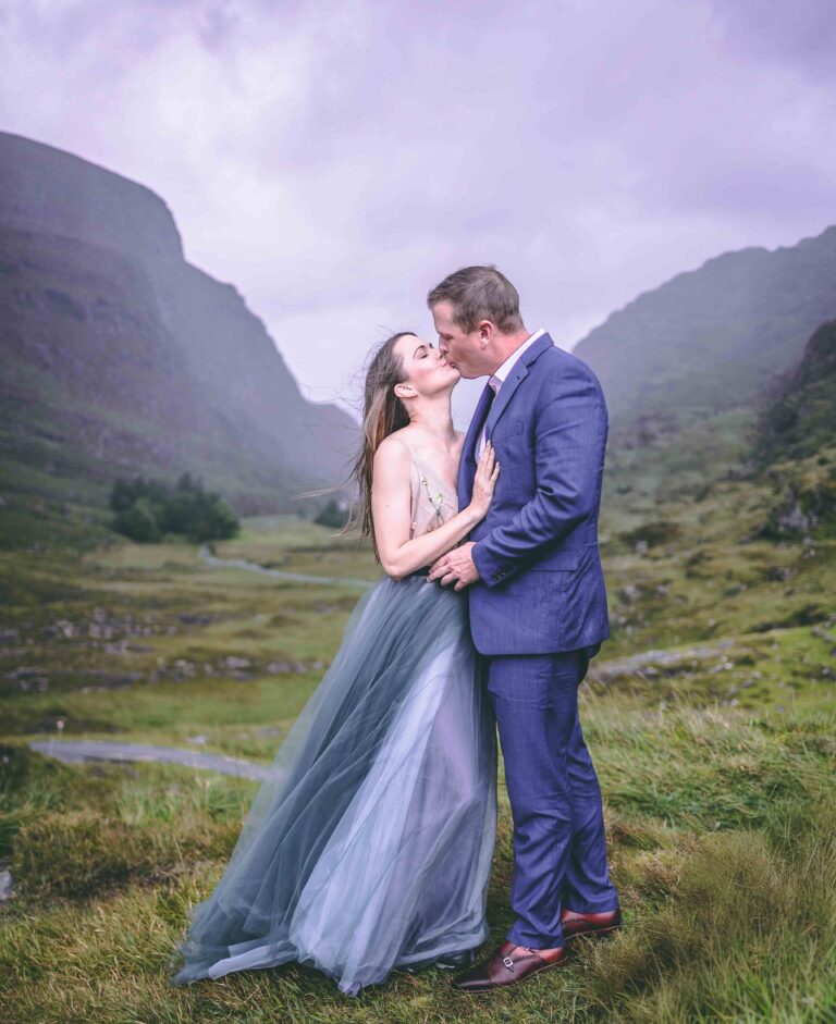 Bride and groom kissing in the Gap of Dunloe mountain pass, Co. Kerry elopement