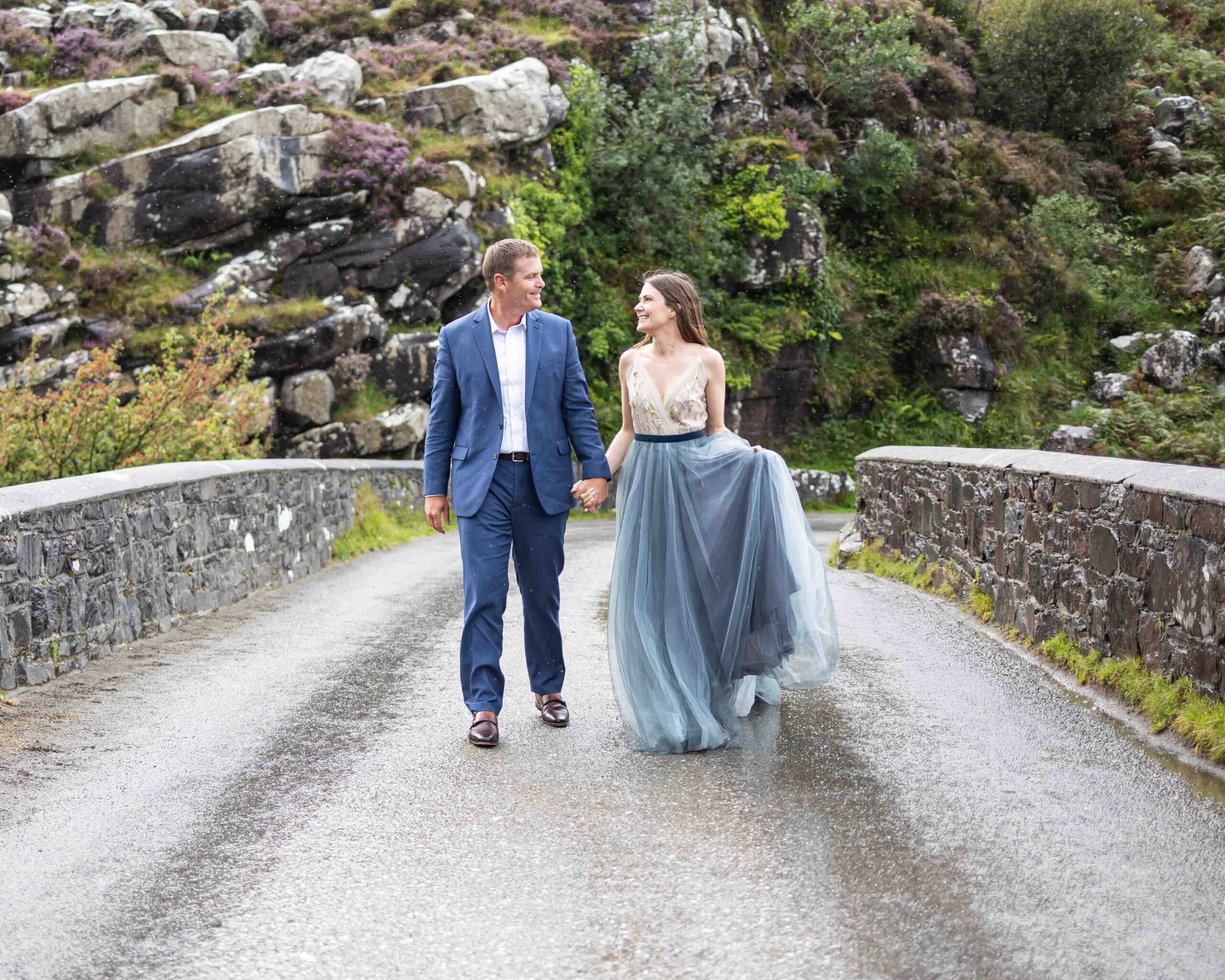 rocky old slate house with rugged backdrop of the Black Valley behind the couple JODPhotography