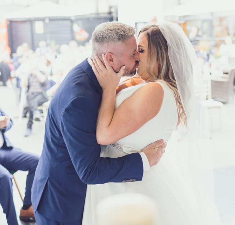 Bride and groom sharing a kiss at their wedding at The Mills Inn, Ballyvourney