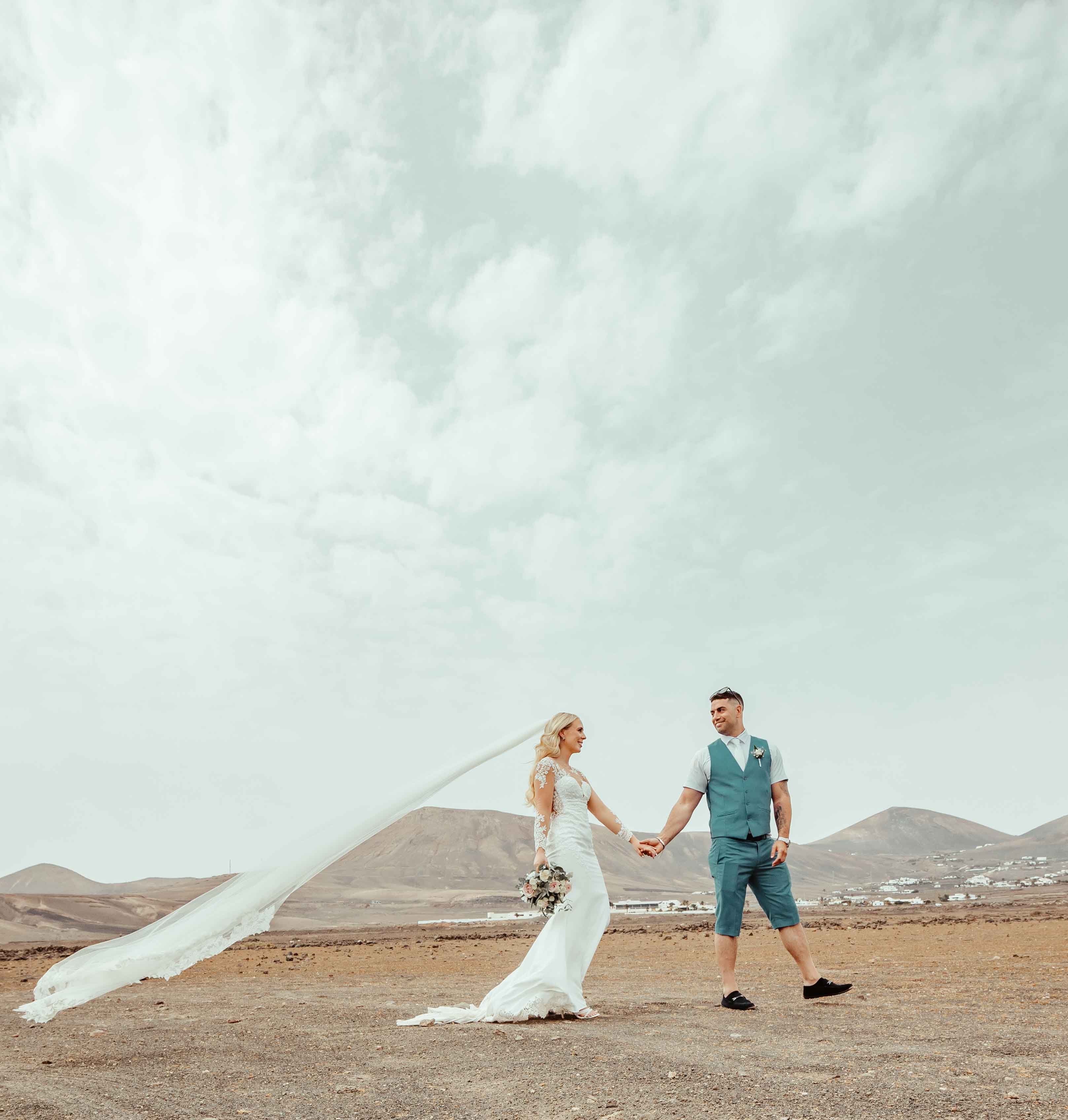Destination wedding photographer, bride and groom walking in lanzarote, Spain- JOD'Photography