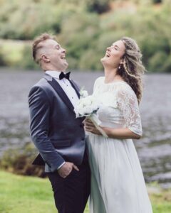 Groom hugging family member after ceremony — JOD Photography