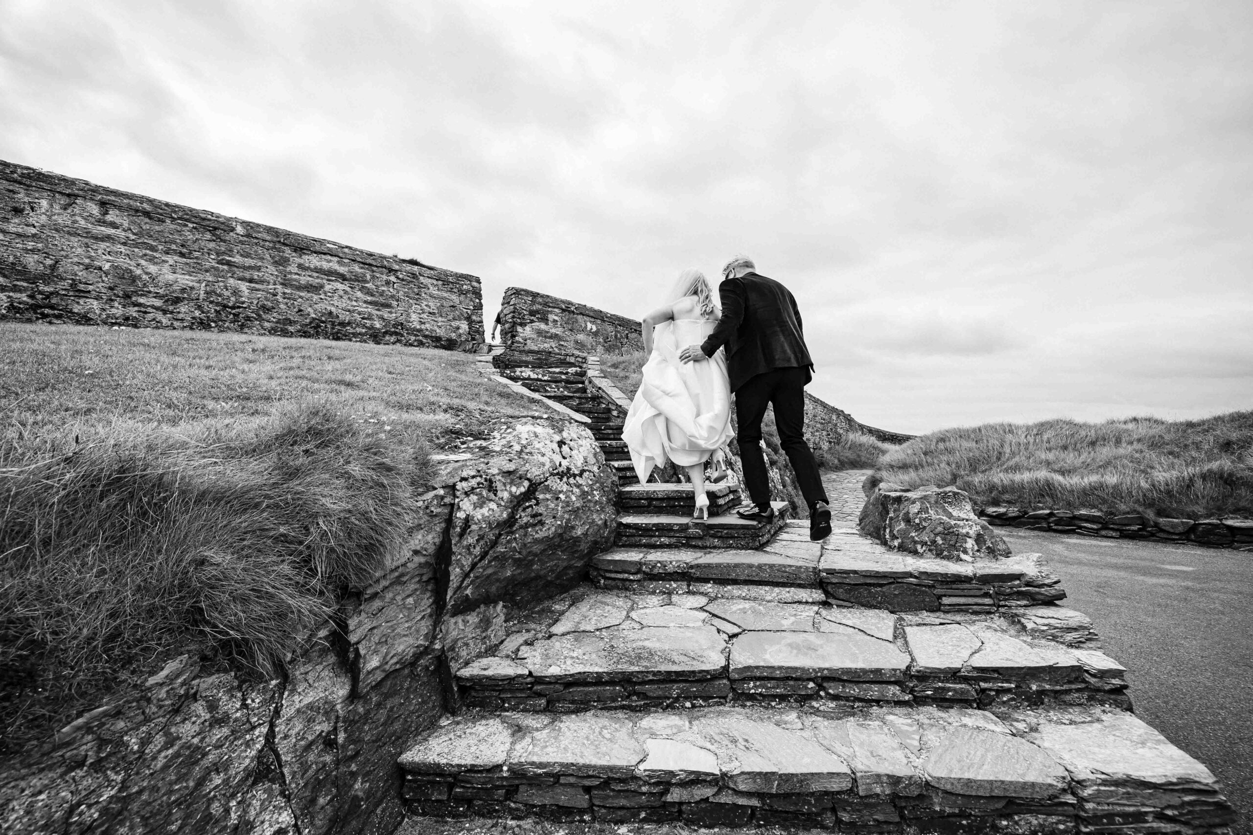 Alison’s wedding dress blowing in the Atlantic wind at Old Head Golf Course – JOD Photography