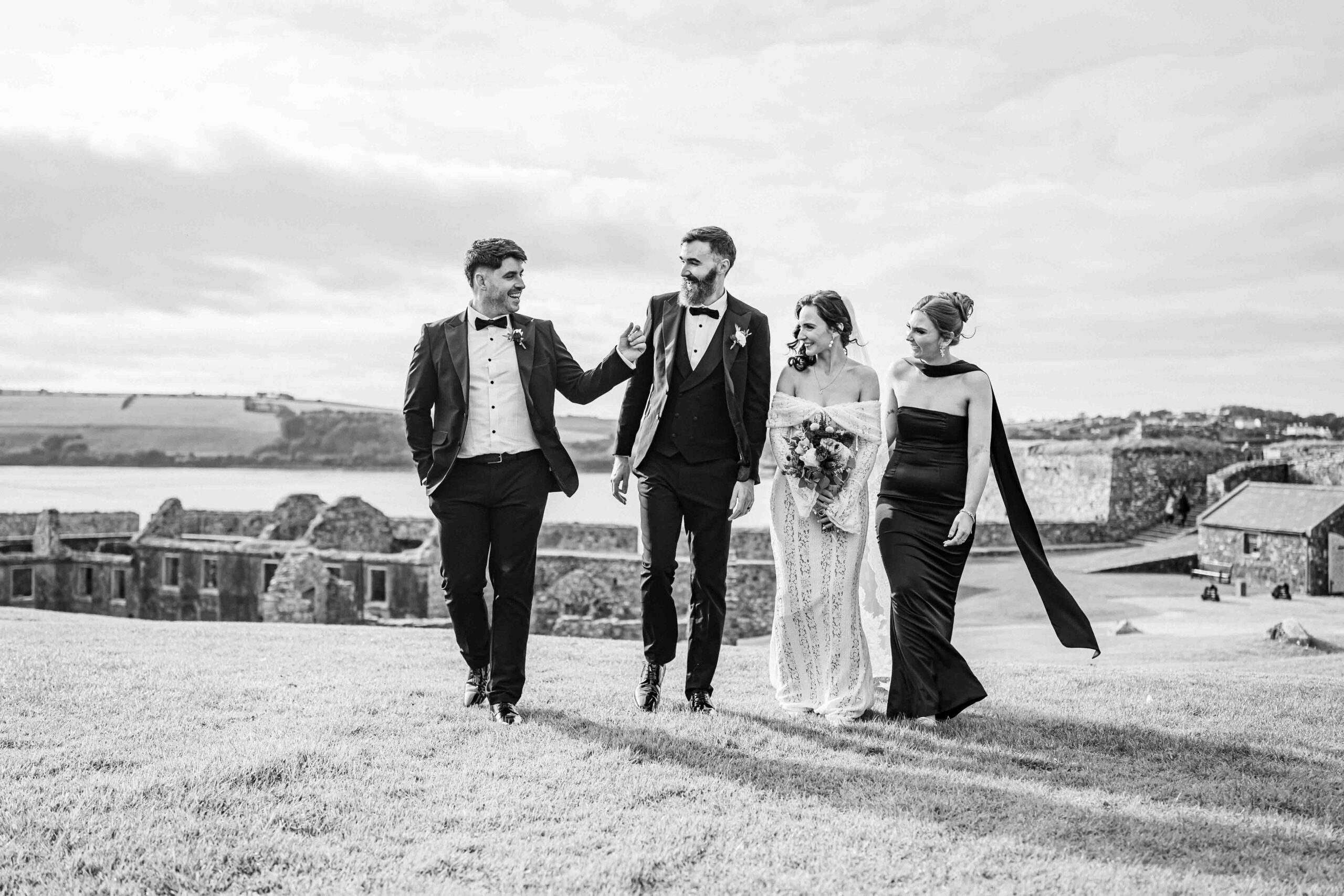 Groom laughing during portraits at Charles Fort — Kinsale wedding photographer — JOD Photography