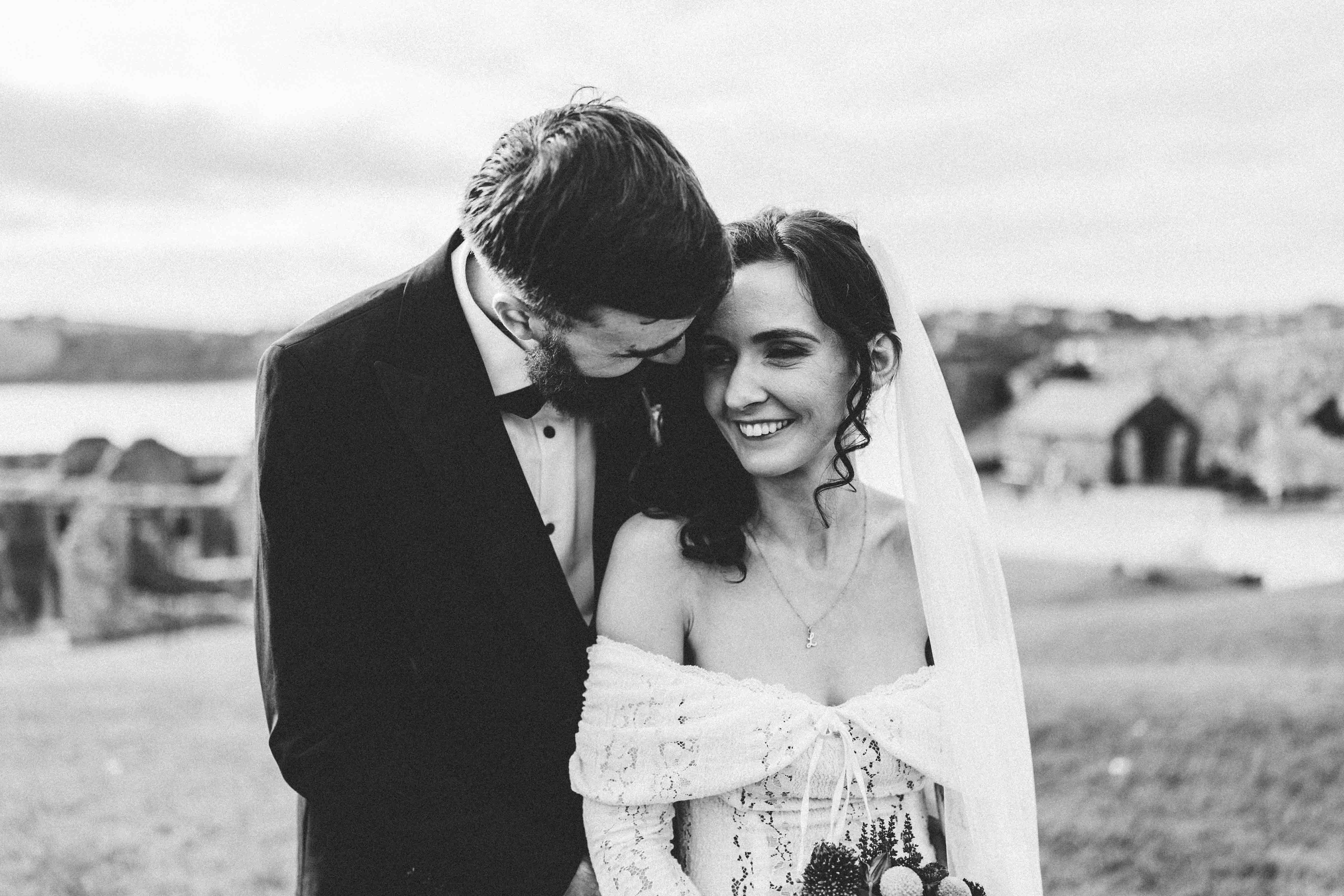 Couple posing with Spanish tourists for fun wedding photo — Kinsale wedding photography — JOD Photography
