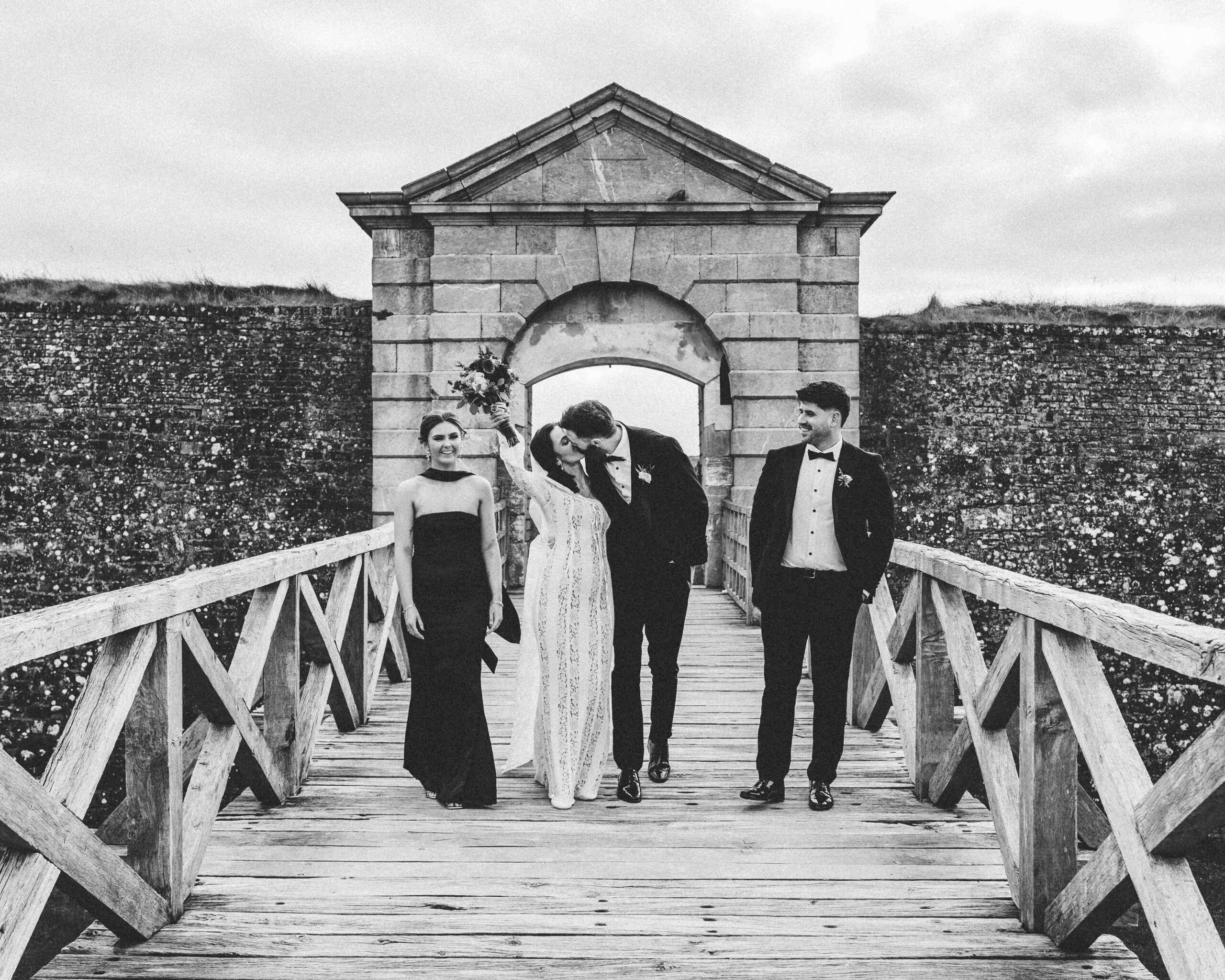 Candid laughter during portraits at Charles Fort — Irish wedding photographer Cork — JOD Photography